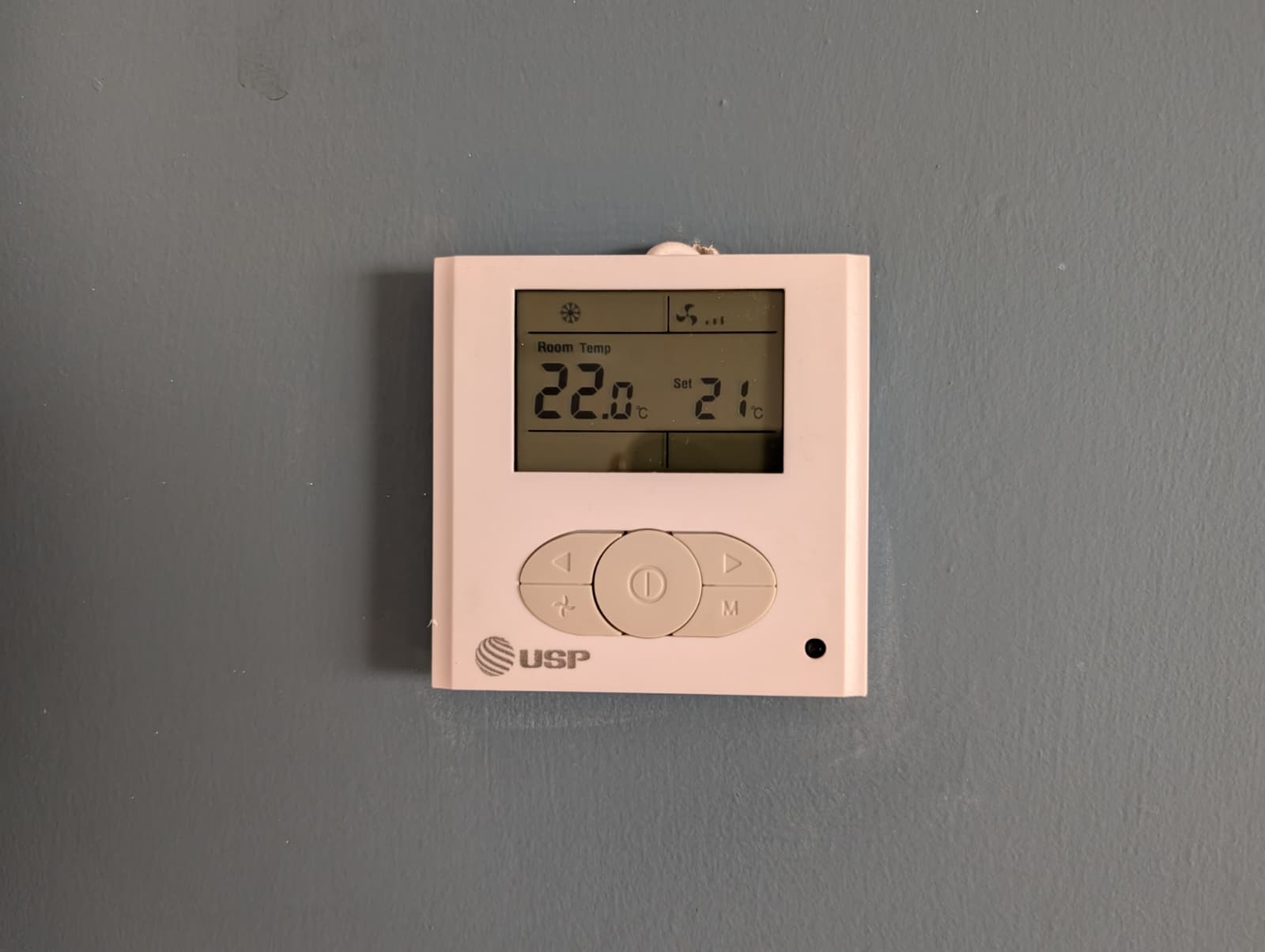 The wall panel: mode, fan, room temp, set temp